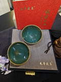 Teal green JianZhan tea cup pair interior view showing luminous teal glaze