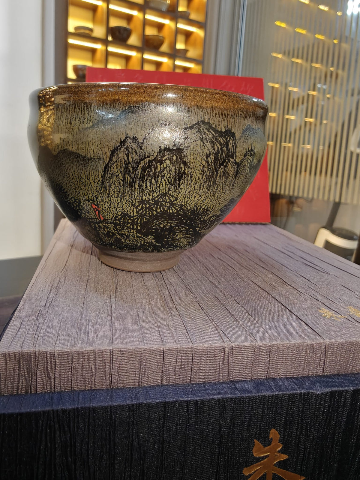 Mountain landscape JianZhan tea bowl showing willow and mountain scene