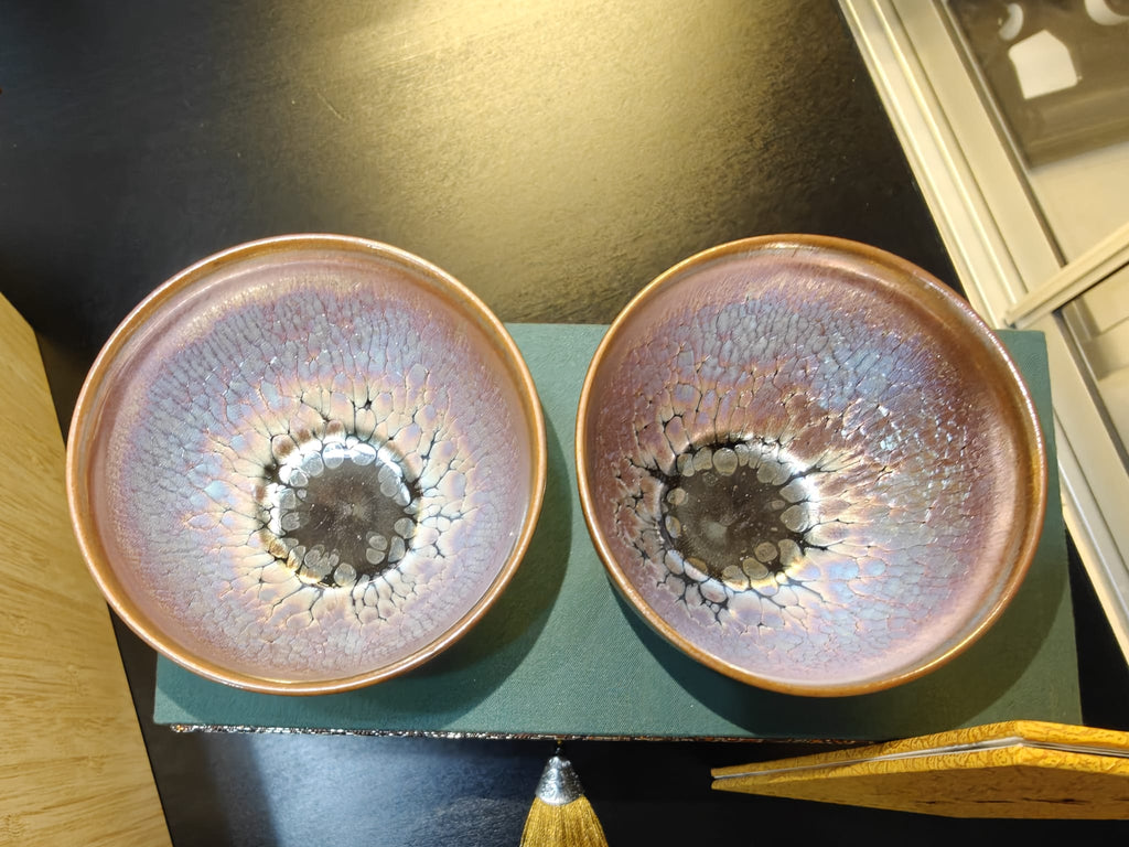 百花 Hundred Flowers pair JianZhan tea bowls interior view showing iridescent purple-silver glaze with dark oil-drop centre