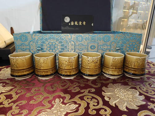 Amber gold carved floral 6-cup set in teal brocade gift box by 青贡龙窑